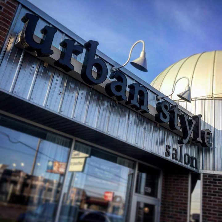 The urban style salon sign on the storefront at 139 Division Street, Waite Park